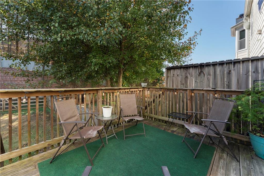 4074 Spring Cove Drive Duluth, GA 30097 - Photo 42 of 48 a view of a deck with two chairs and a table