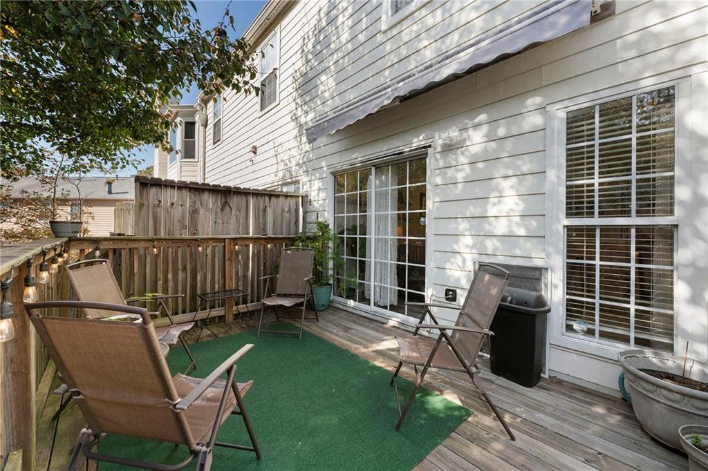 4074 Spring Cove Drive Duluth, GA 30097 - Photo 43 of 48 a view of a chair and table in the back yard of the house