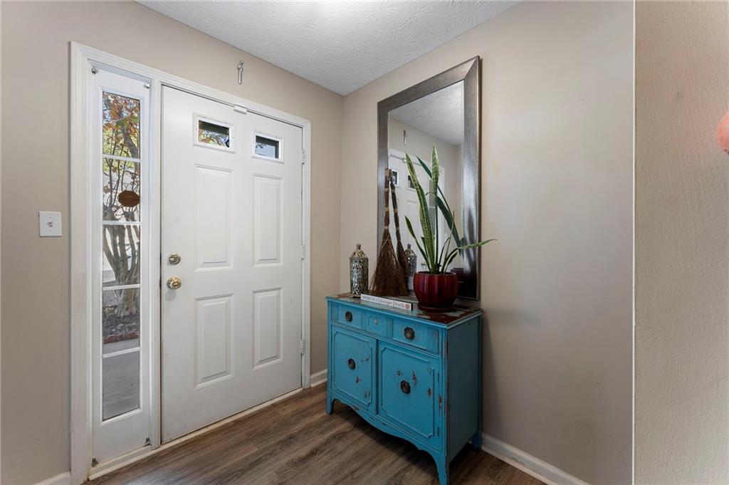 4074 Spring Cove Drive Duluth, GA 30097 - Photo 5 of 48 a view of a hallway with closet and mirror