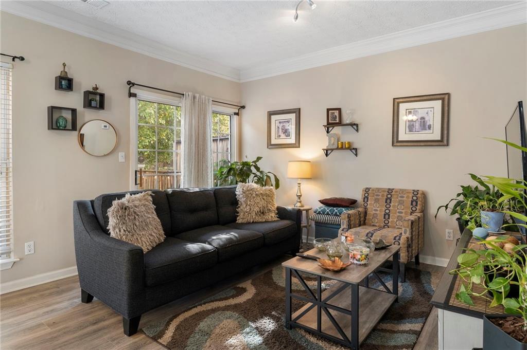 4074 Spring Cove Drive Duluth, GA 30097 - Photo 7 of 48 a living room with furniture and a window