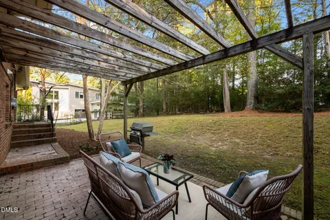 a house view with a sitting space and garden