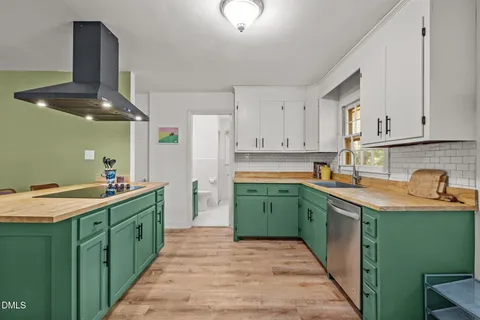 a living room with furniture a rug and a chandelier