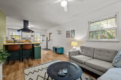 a bedroom with bed and wooden floor