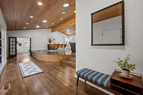 a view of a house with a yard balcony and sitting area