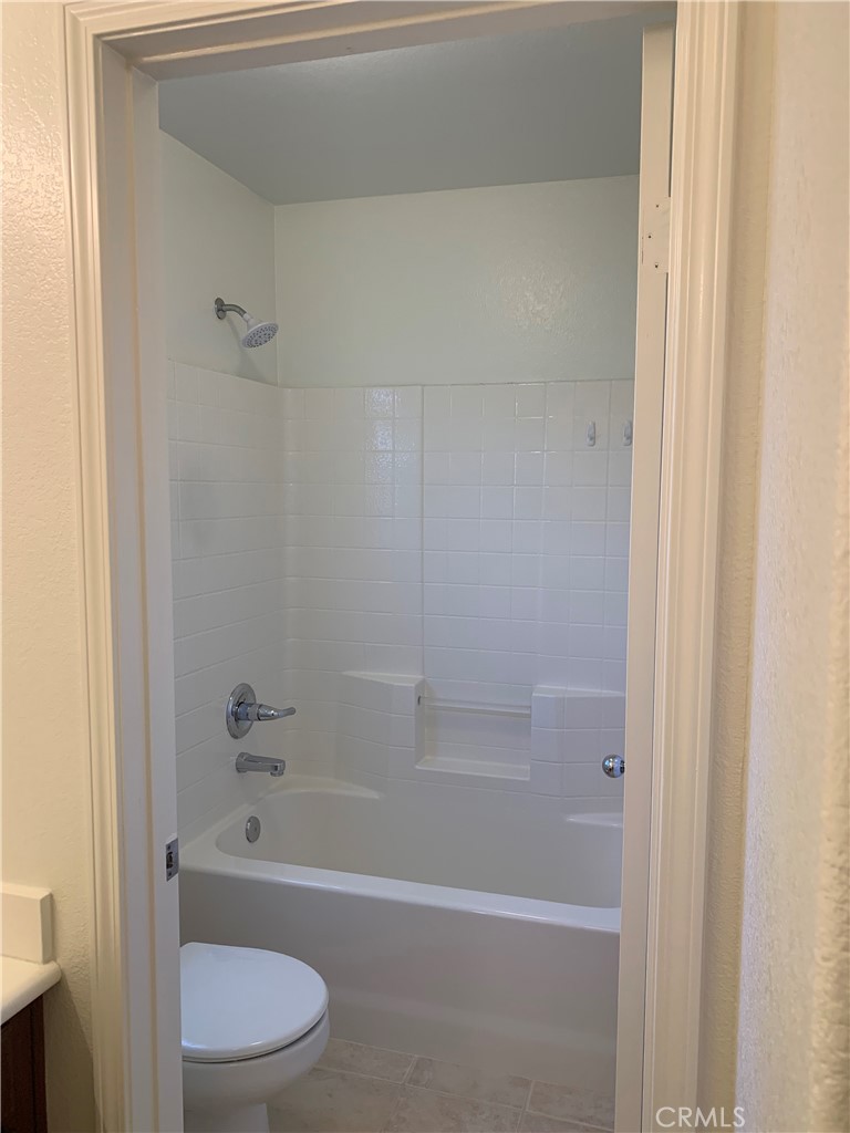 33782 Channel Street Temecula, CA 92592 - Photo 13 of 30 a bathroom with a bathtub and a toilet