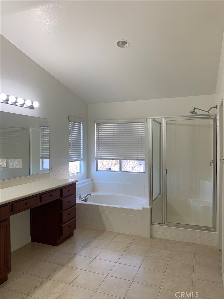 33782 Channel Street Temecula, CA 92592 - Photo 21 of 30 a large bathroom with a large tub and shower