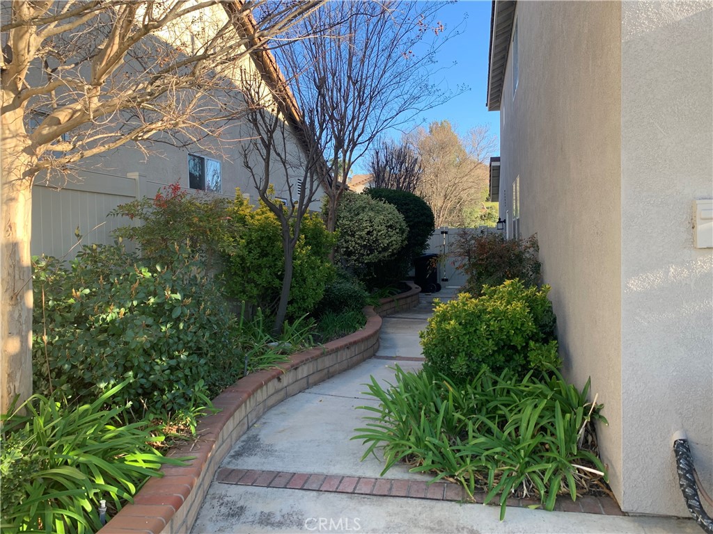 33782 Channel Street Temecula, CA 92592 - Photo 25 of 30 a front view of a house with garden