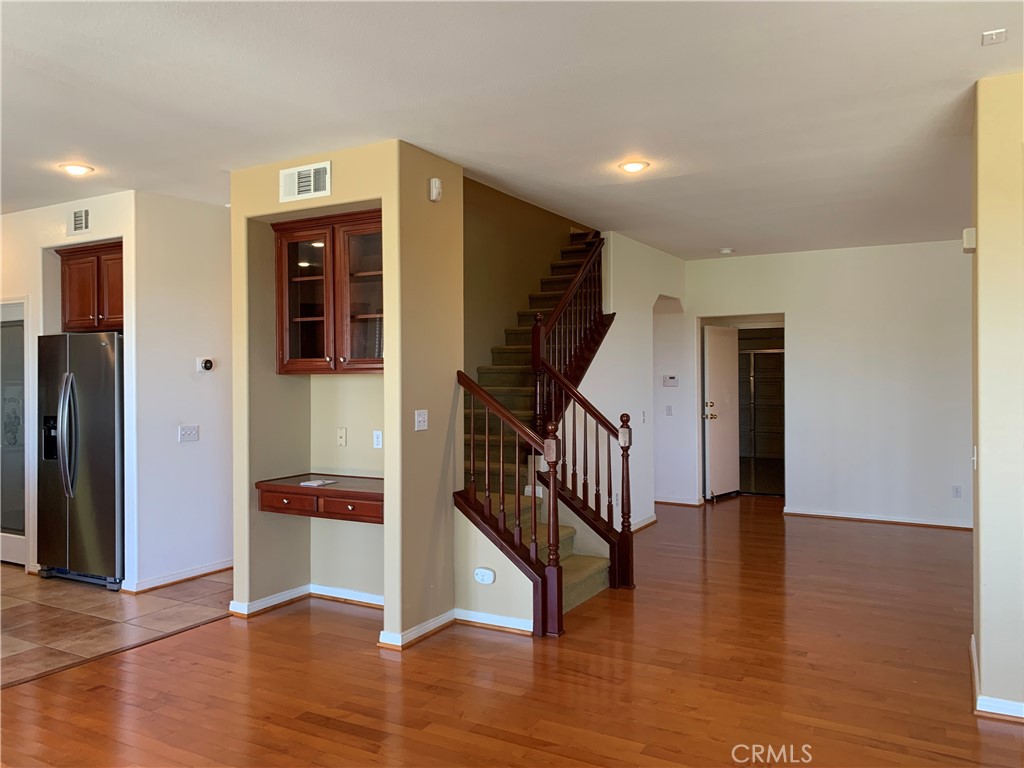 33782 Channel Street Temecula, CA 92592 - Photo 3 of 30 a view of entryway with wooden floor and stairs