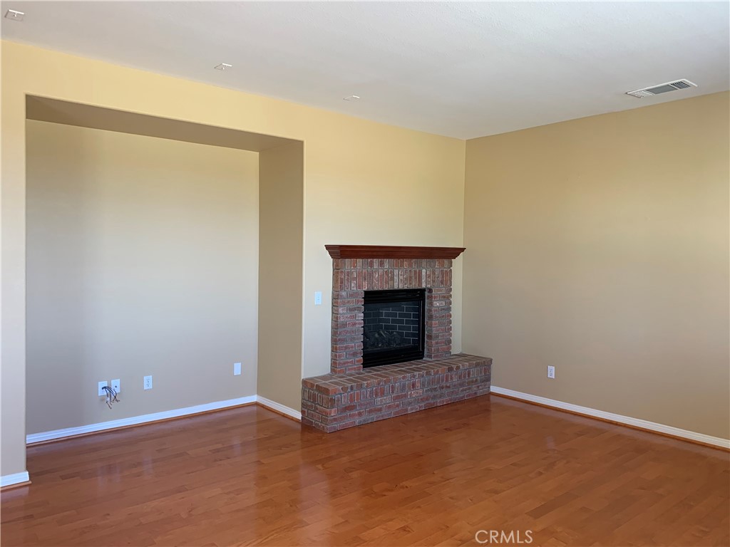 33782 Channel Street Temecula, CA 92592 - Photo 8 of 30 a view of an empty room with a fireplace