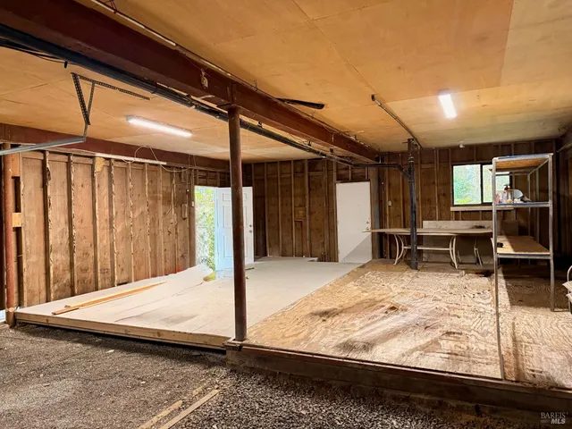 a view of a hall with wooden floor