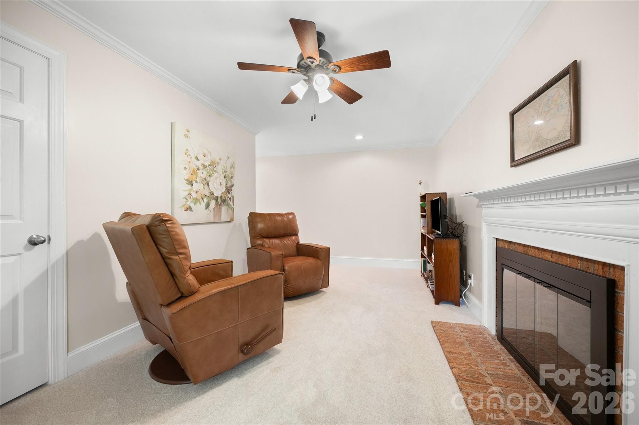 636 Landsdowne Court Fort Mill, SC 29708 - Photo 27 of 48 a living room with furniture and a fireplace