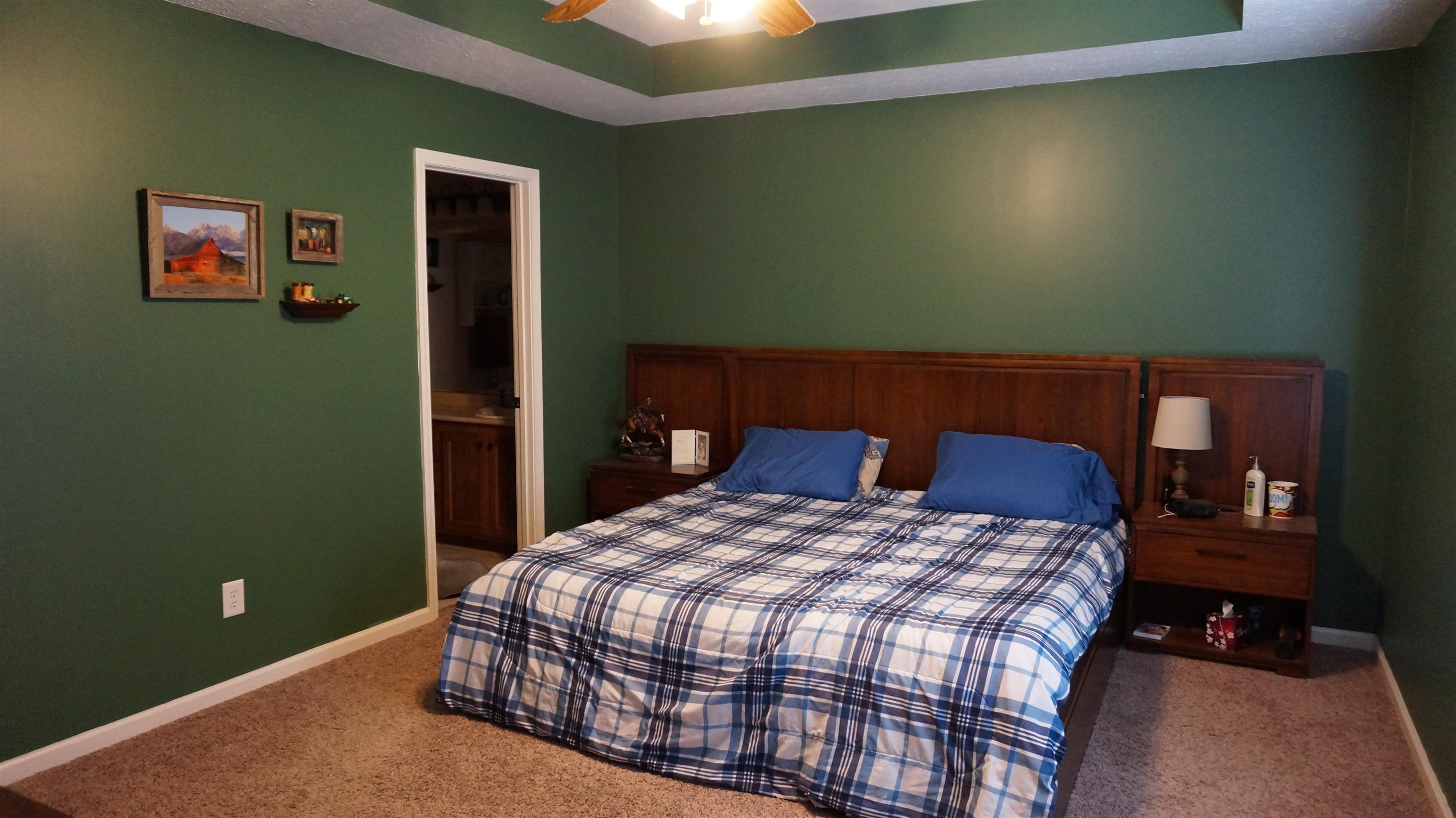 7558 South Swift Road Goodlettsville, TN 37072 - Photo 11 of 18 a bedroom with a bed and wooden floor