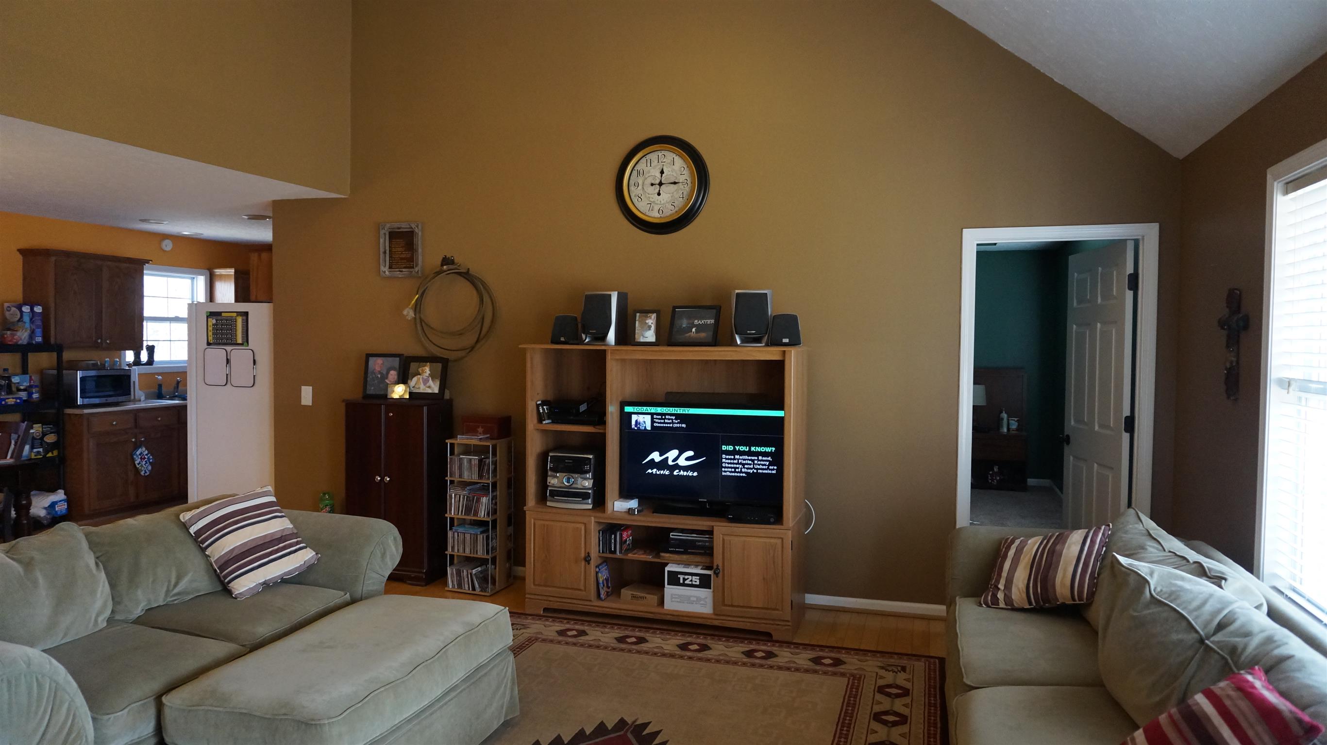 7558 South Swift Road Goodlettsville, TN 37072 - Photo 4 of 18 a living room with furniture a clock and a table