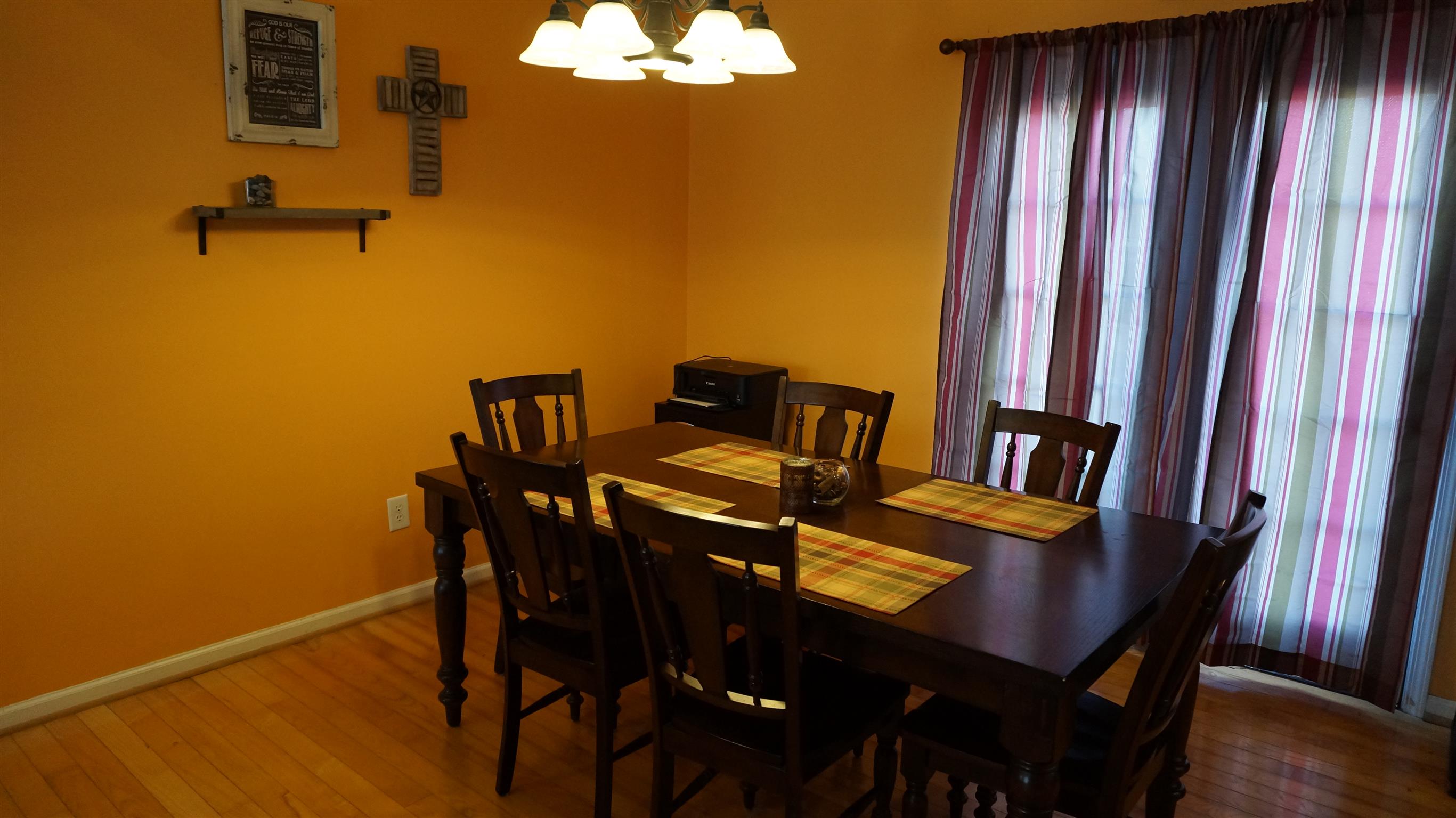 7558 South Swift Road Goodlettsville, TN 37072 - Photo 6 of 18 a view of a dining room with furniture and wooden floor