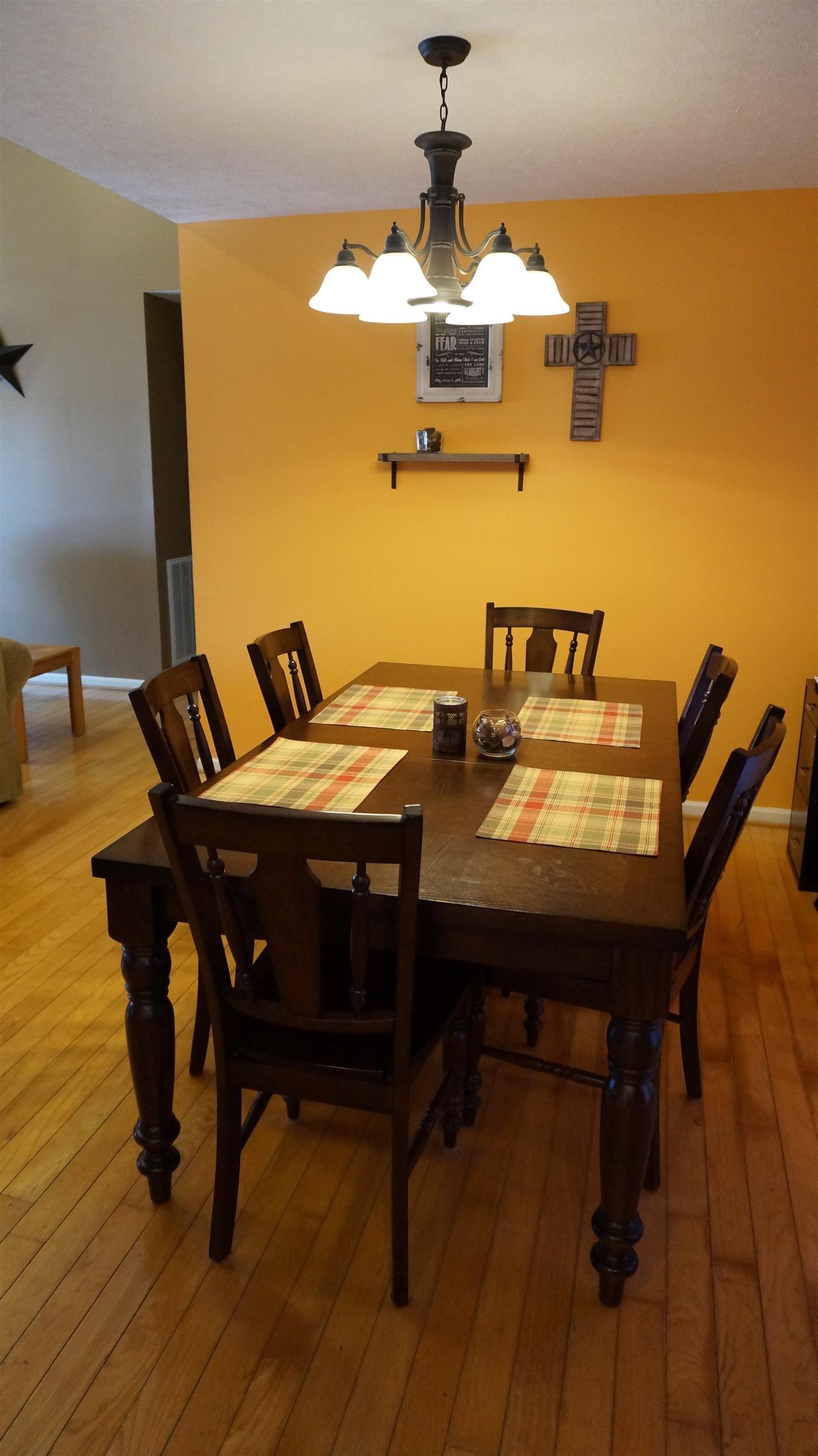 7558 South Swift Road Goodlettsville, TN 37072 - Photo 7 of 18 a view of a dining room with furniture and wooden floor