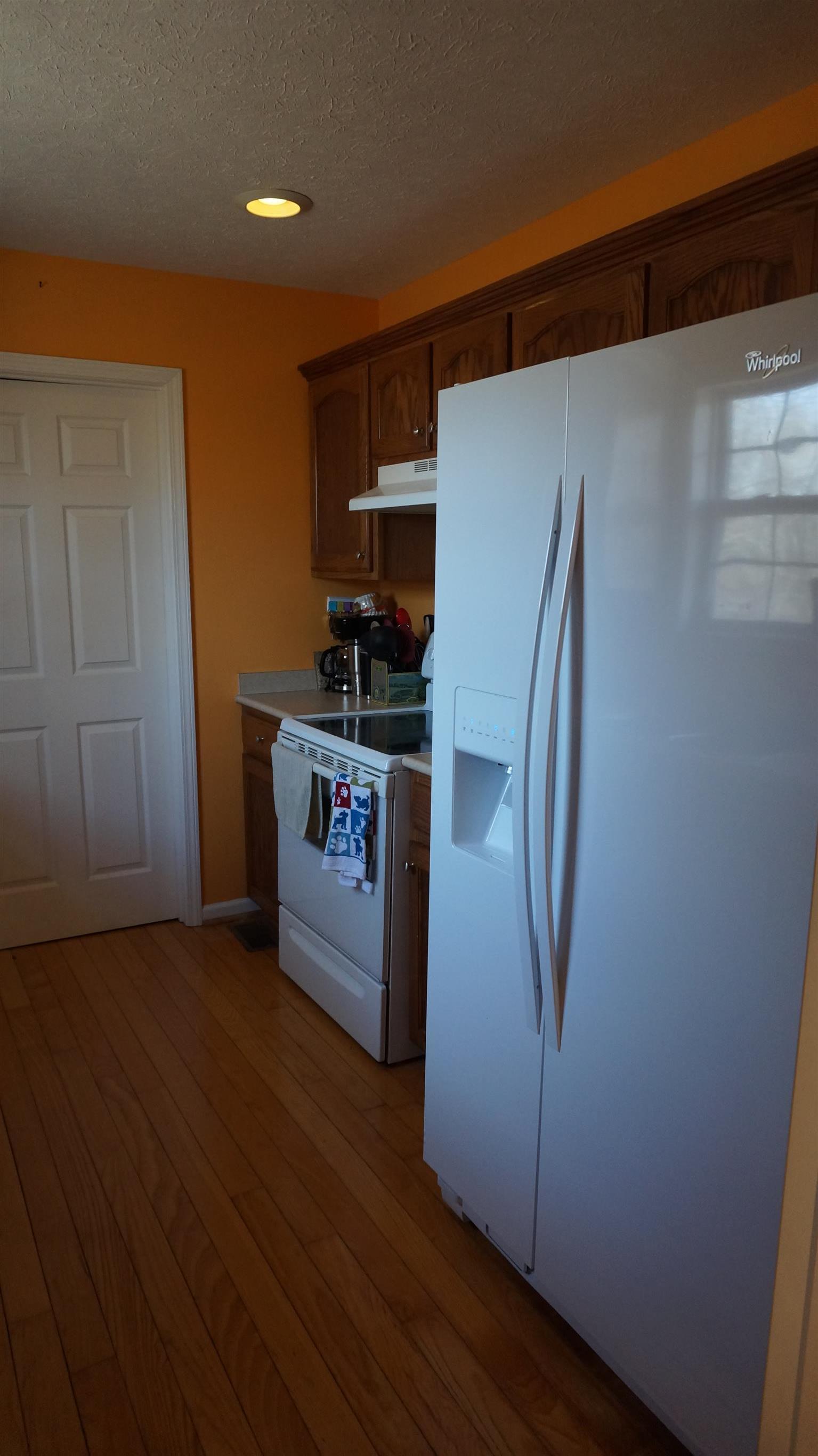 7558 South Swift Road Goodlettsville, TN 37072 - Photo 10 of 18 a kitchen with stainless steel appliances a refrigerator and a stove