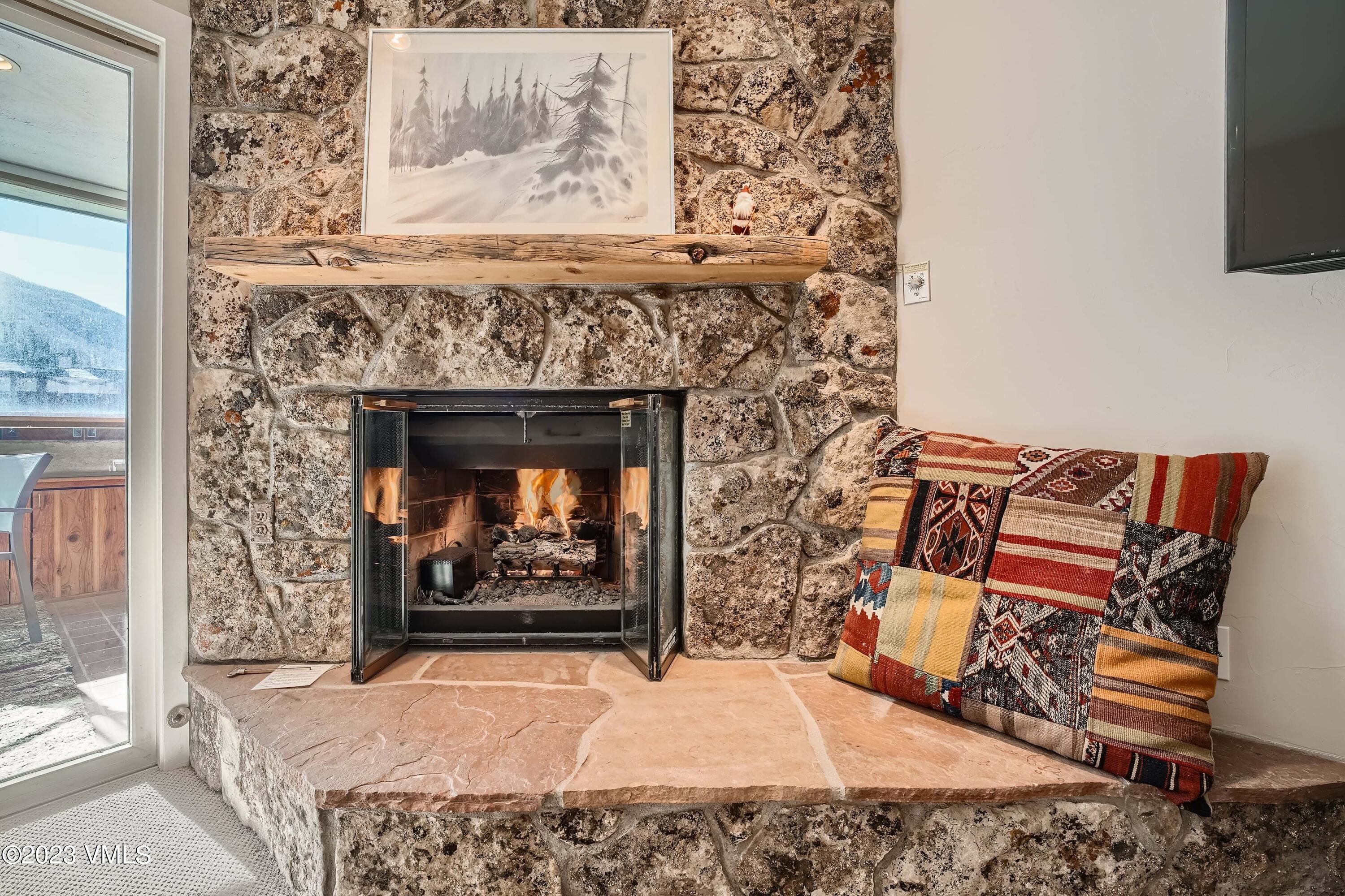1030 Lions Ridge Loop, Unit 202 Vail, CO 81657 - Photo 5 of 25 view of living room with furniture and fireplace