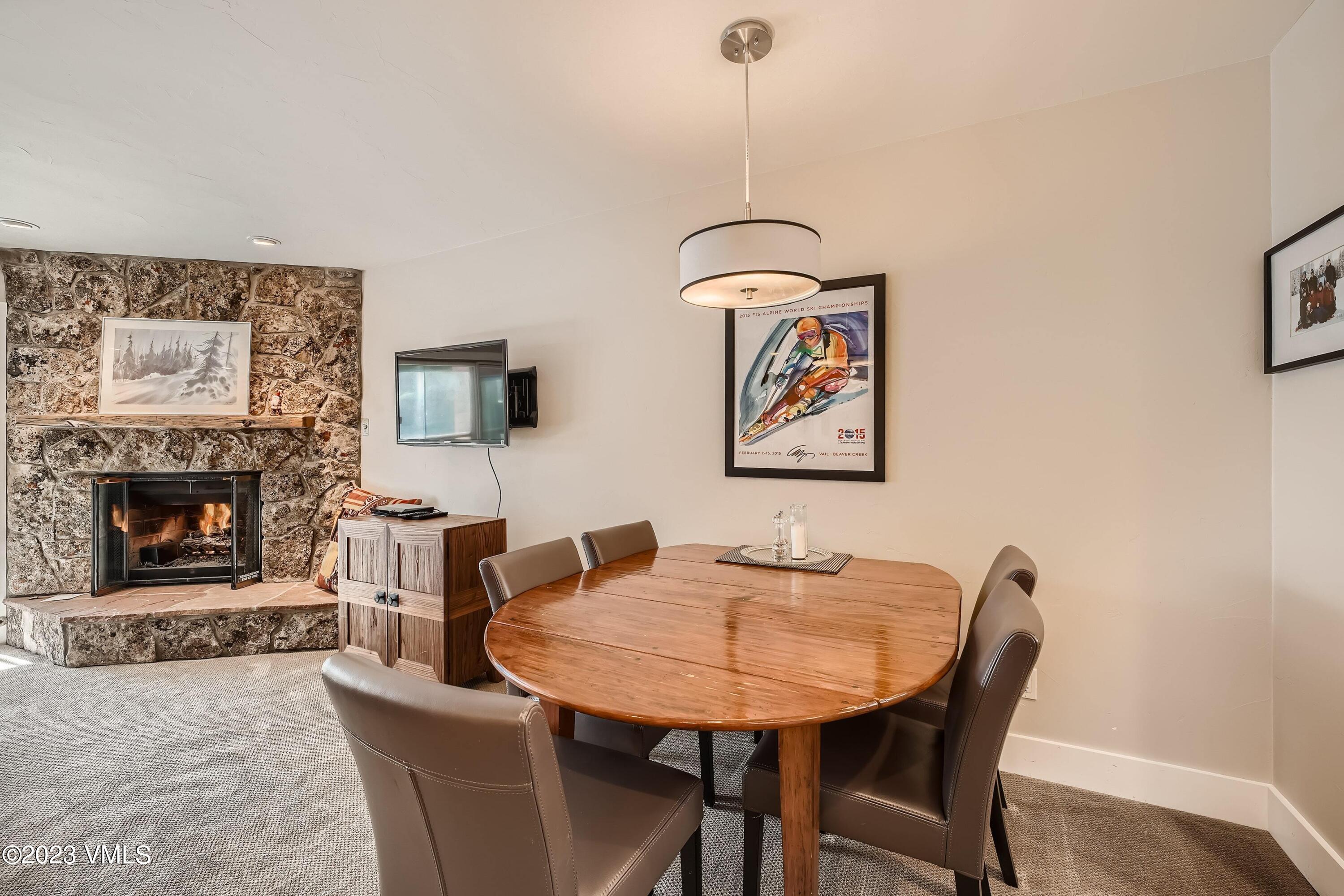 1030 Lions Ridge Loop, Unit 202 Vail, CO 81657 - Photo 7 of 25 a view of a dining room with furniture