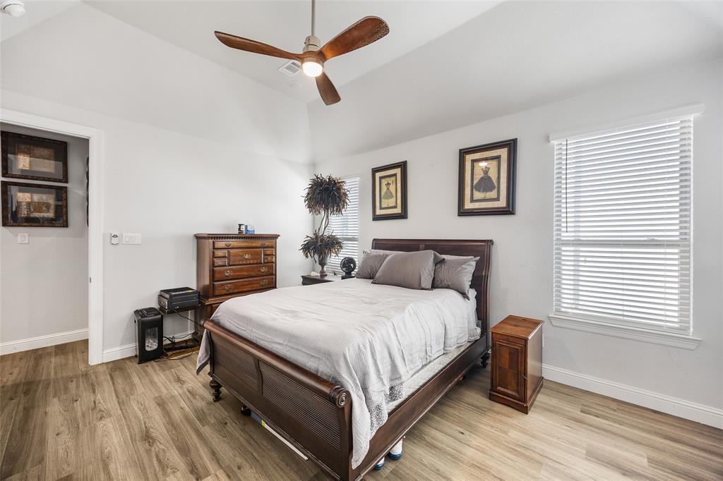 2628 Flycatcher Road Fort Worth, TX 76118 - Photo 17 of 38 Bedroom with light wood finished floors, a ceiling fan, and lofted ceiling