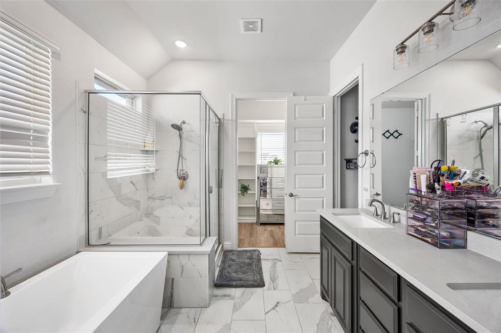 2628 Flycatcher Road Fort Worth, TX 76118 - Photo 19 of 38 Full bathroom featuring a soaking tub, a stall shower, a spacious closet, double vanity, and light marble finish flooring
