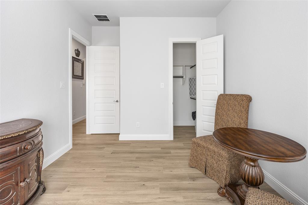 2628 Flycatcher Road Fort Worth, TX 76118 - Photo 24 of 38 Living area featuring baseboards and light wood-style flooring
