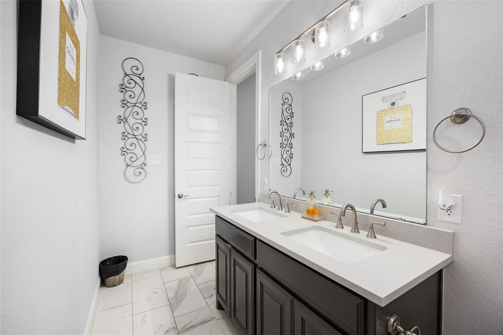 2628 Flycatcher Road Fort Worth, TX 76118 - Photo 30 of 38 Full bath with double vanity and light marble finish flooring