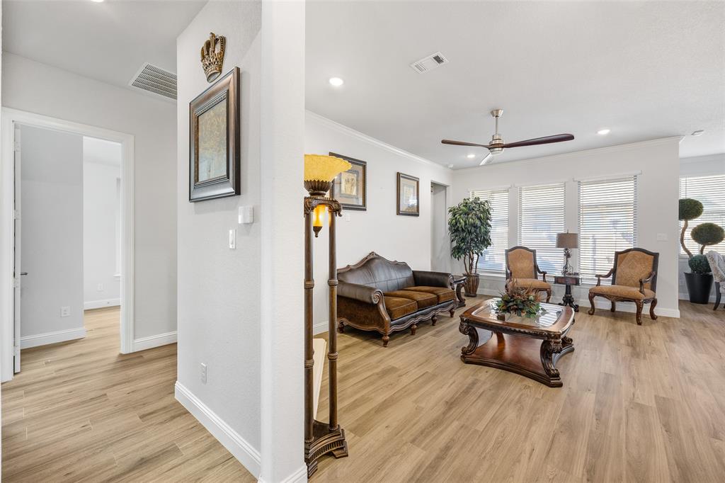 2628 Flycatcher Road Fort Worth, TX 76118 - Photo 5 of 38 Living room featuring recessed lighting, light wood-style flooring, ceiling fan, and crown molding