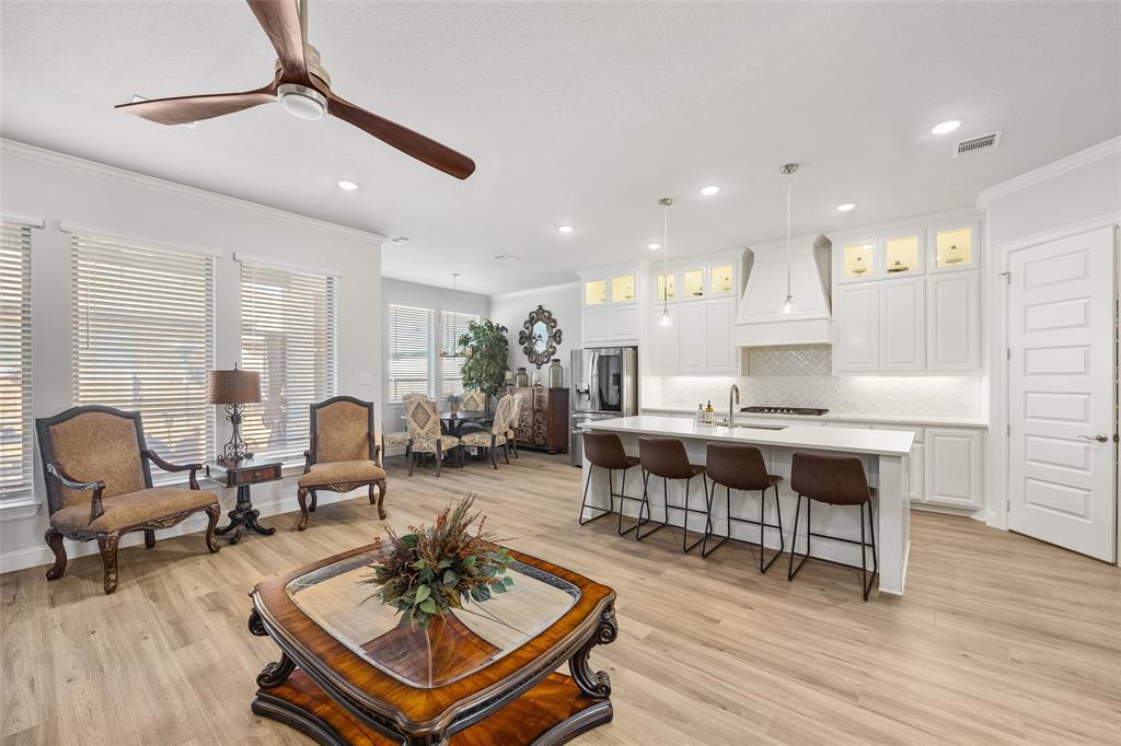 2628 Flycatcher Road Fort Worth, TX 76118 - Photo 8 of 38 Living area featuring crown molding, light wood finished floors, a ceiling fan, and recessed lighting