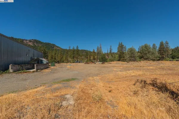 a view of a road with a building in the background