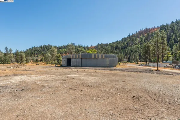 a view of a yard covered in snow