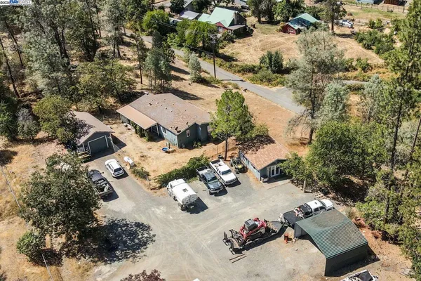 an aerial view of a house with yard swimming pool and outdoor seating