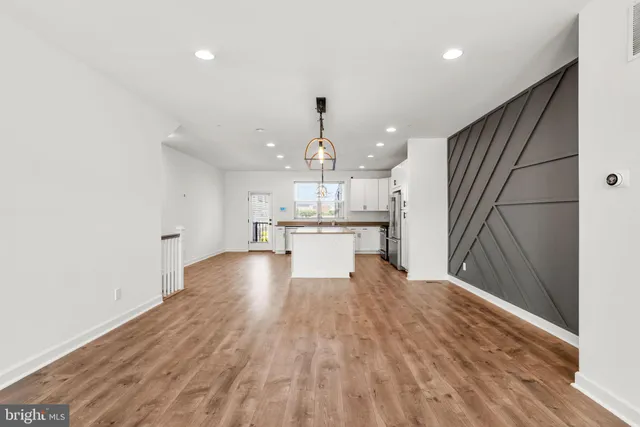 a view of kitchen with wooden floor