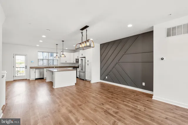 a view of kitchen with wooden floor