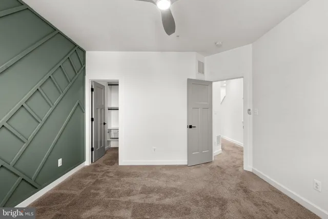 a bathroom with a sink vanity and a mirror