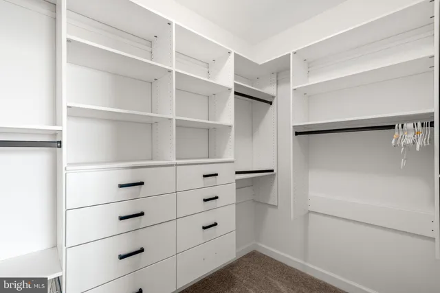 a bathroom with a toilet sink shower and mirror