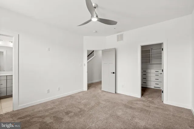 a bathroom with a sink vanity and a mirror