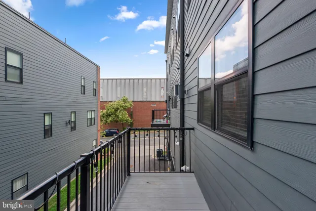a view of a terrace with outdoor seating and city view