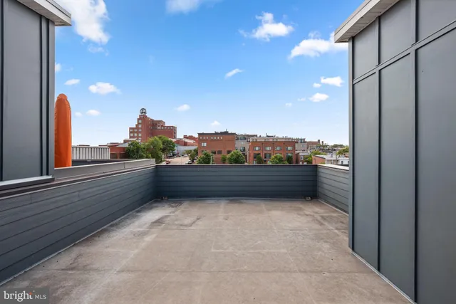 a view of a brick building with many windows