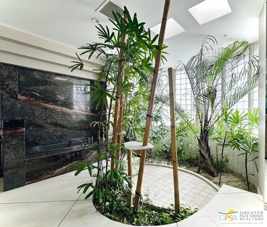 a picture of a glass door with yard in front of it