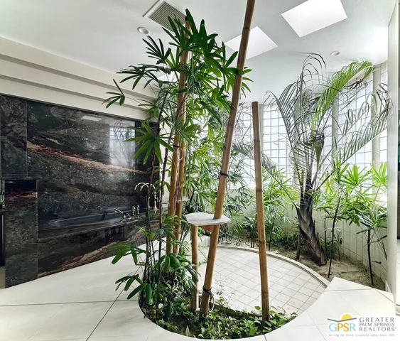 a picture of a glass door with yard in front of it