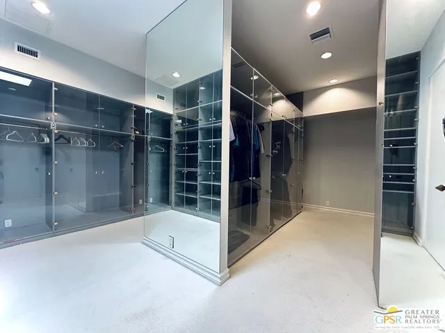 a bathroom with a glass shower door