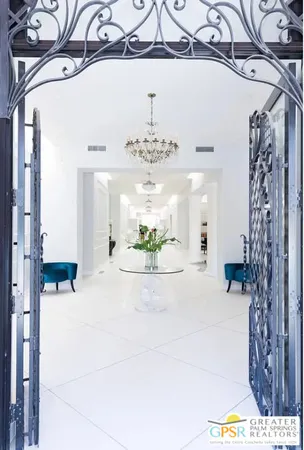 a view of a hallway with a chandelier