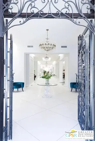 a view of a hallway with a chandelier