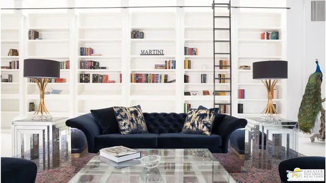 a living room with furniture and a lamp