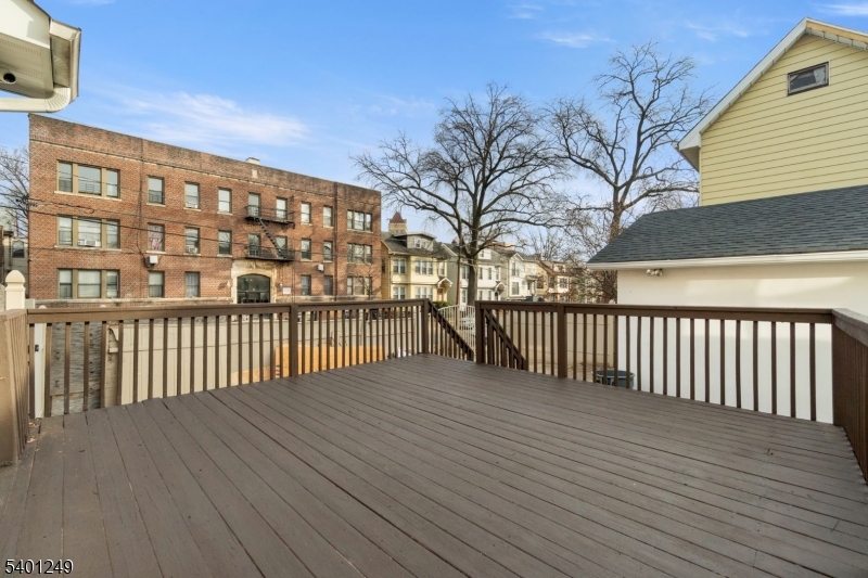 390 Clinton Place Newark, NJ 07112 - Photo 16 of 17 a view of a balcony with wooden floor
