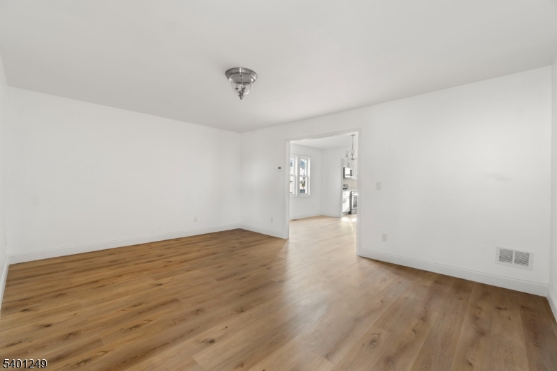 390 Clinton Place Newark, NJ 07112 - Photo 3 of 17 wooden floor in an empty room