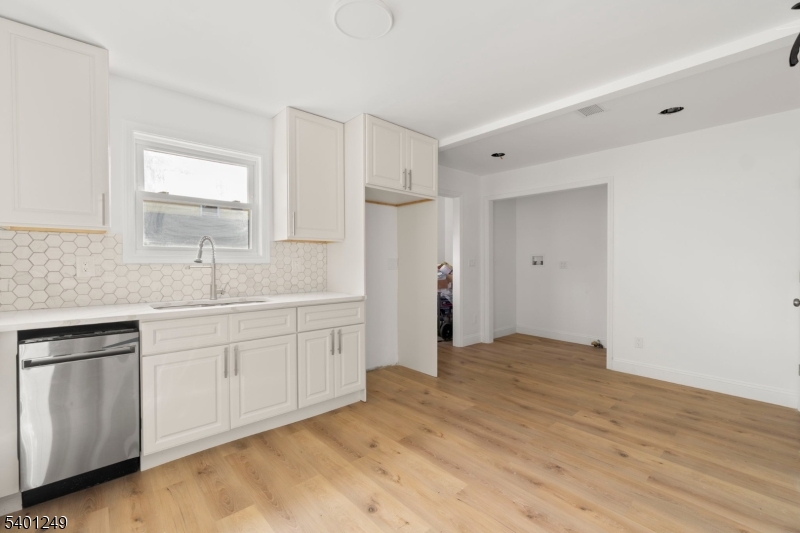 390 Clinton Place Newark, NJ 07112 - Photo 7 of 17 a bathroom with a sink and a mirror