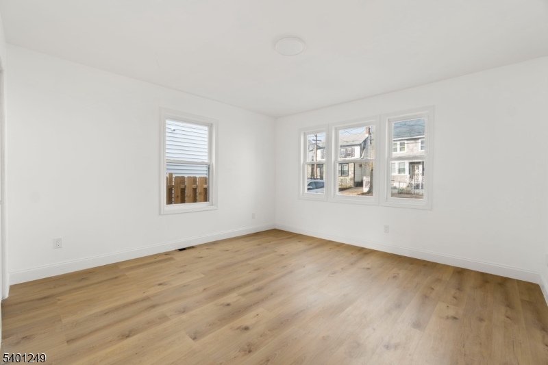 390 Clinton Place Newark, NJ 07112 - Photo 8 of 17 an empty room with windows