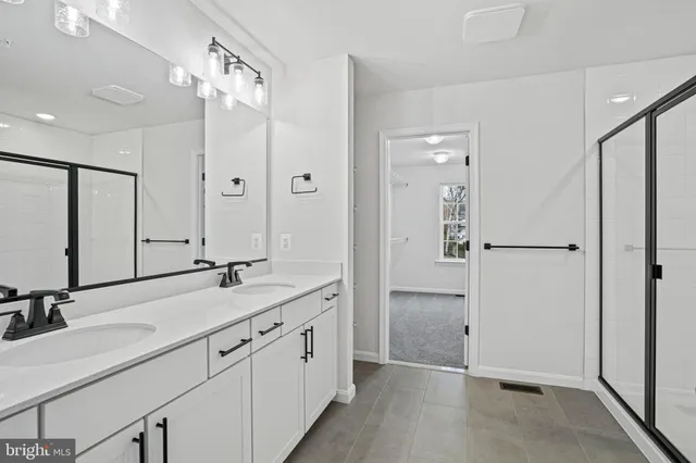 a view of a bathroom with a glass shower door