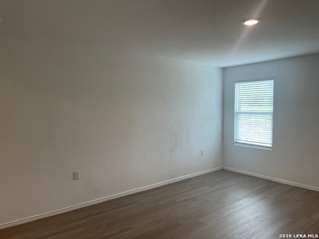 918 Cook Bend San Antonio, TX 78221 - Photo 14 of 21 an empty room with wooden floor and window